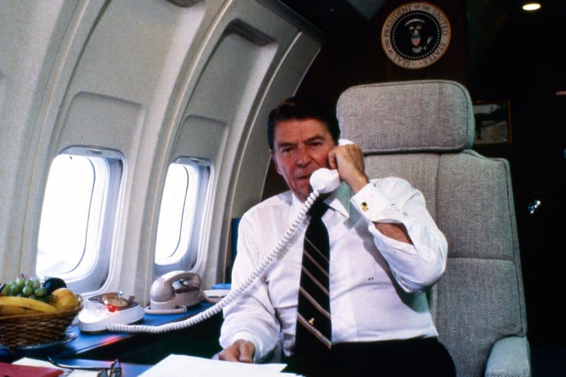 President Ronald Reagan talks on the phone from Air Force One on November 10, 1982. On April 20, 1983, Reagan signed a $165 billion Social Security rescue plan to keep the retirement system solvent. UPI File Photo