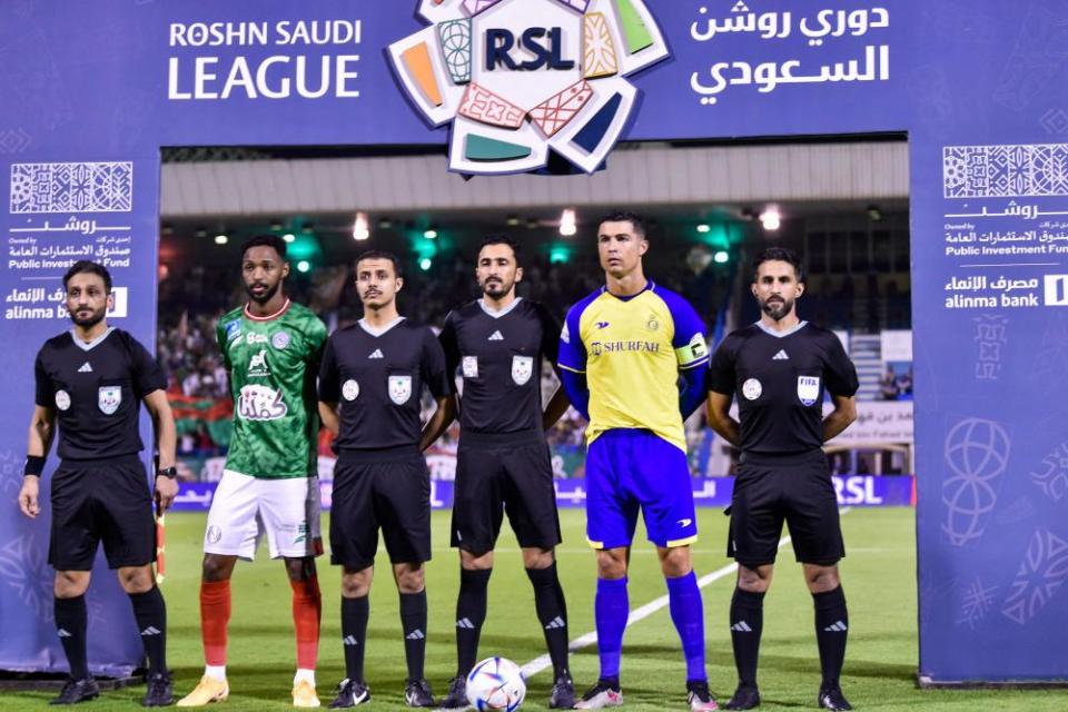 Cristiano Ronaldo pictured with the officials before Al-Nassr’s game against Al-Ettifaq last month