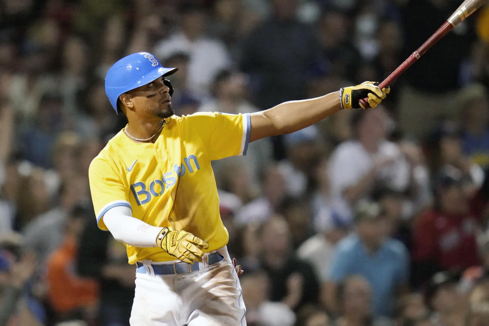 Boston Red Sox's Xander Bogaerts watches the flight of his two-run home run in the fifth inning of a baseball game against the New York Mets at Fenway Park, Tuesday, Sept. 21, 2021, in Boston. (AP Photo/Charles Krupa)