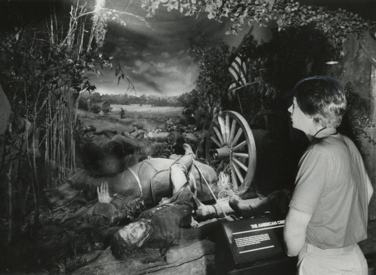 1983 - COSI carpenter Mark Gordon looks over the panorama "The American Crisis," a part of the new exhibit "The Time Tunnel."