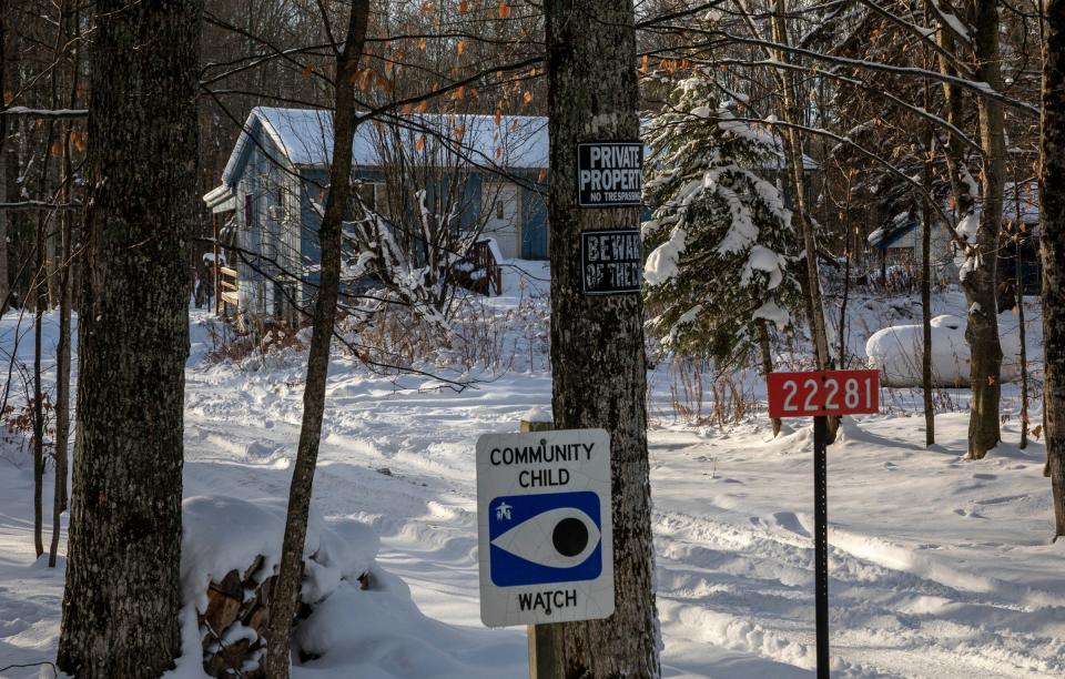 A private property sign hangs from a tree in front of a home early morning in Luce County on Thursday, Nov. 30, 2023. The home is where Denny Murdock used to live and where people believe Derrick Henagan spent his final weekend.