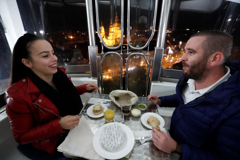 Lutor and Katus enjoy their food as Michelin-starred restaurant Costes moves into the Budapest Eye ferris wheel during the coronavirus outbreak