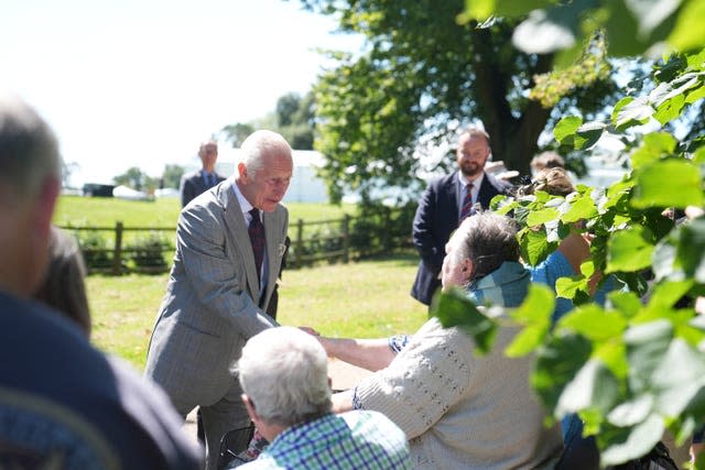 King Charles III speaks with well wishers after attending a Sunday church service at St Mary Magdalene Church in Sandringham, Norfolk