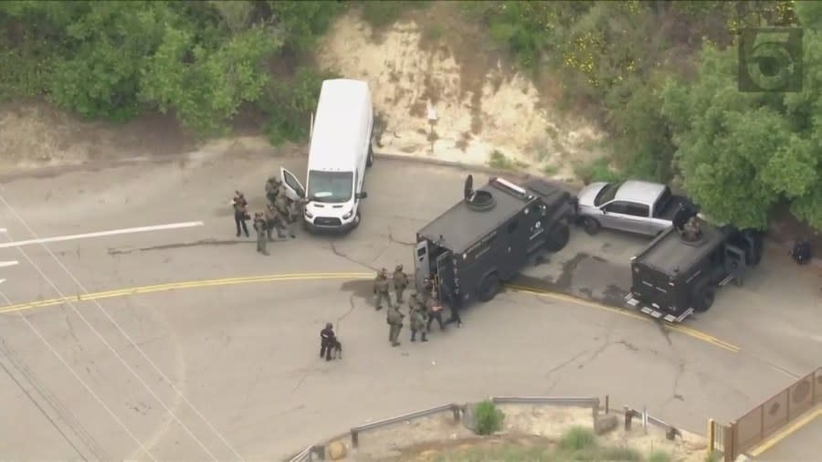 SWAT teams seen surrounding Rhean Fontanoza's truck in Orange on May 16, 2024. (KTLA)