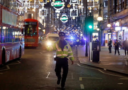 A police officer walks along Oxford Street, in central London, Britain November 24, 2017. REUTERS/Peter Nicholls