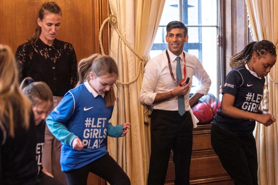 rishi sunak watches girls play football