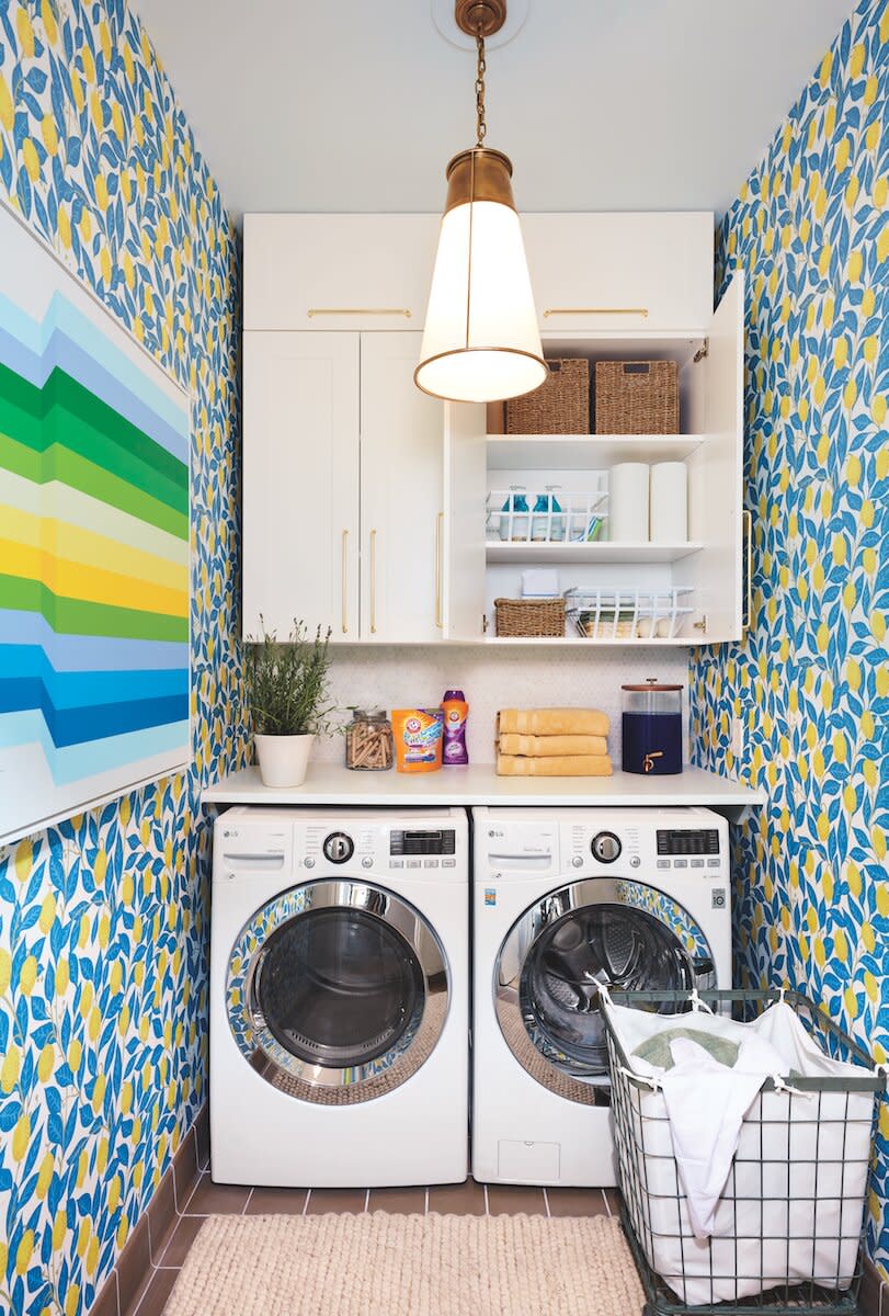 Real Simple Home organized laundry room with floral wallpaper
