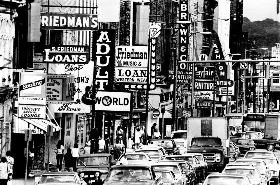 Heavy traffic creeps along Lower Broadway on Oct. 7, 1980, with many people drawn by the furniture companies, small businesses and tourist-oriented enterprises.