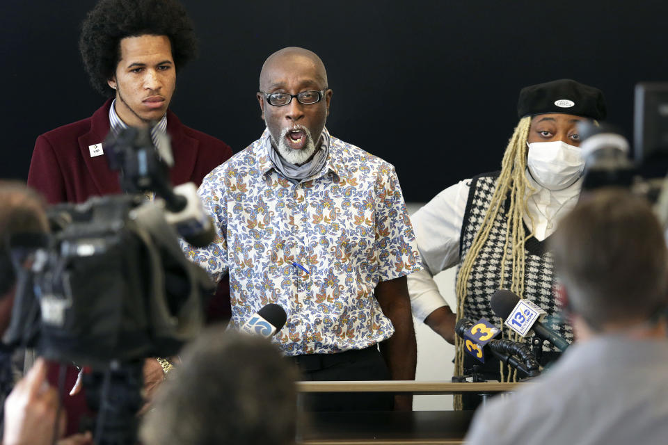 Donovon Lynch's family and friends, including his father Wayne, center, respond, Wednesday, Dec. 1, 2021, in Virginia Beach, Va., to the prior day's report presented to the media by the Virginia Beach Commonwealth Attorney's office on Donovon's death. The city of Virginia Beach will pay $3 million to settle a lawsuit from the family of Donovon Lynch, a Black man who was shot by police during a chaotic night of violence on the city’s oceanfront last year. (Stephen M. Katz/The Virginian-Pilot via AP, File)