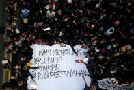 FILE PHOTO: University students protest outside the Indonesian parliament in Jakarta