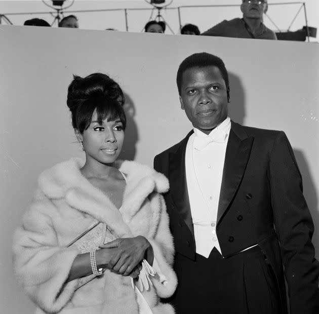 Actor Sidney Poitier with actress Diahann Carroll attend the 36th Academy Awards in Santa Monica, California. (Photo: Photo by Earl Leaf/Michael Ochs Archives/Getty Images)