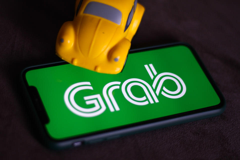 Grab logo displayed on a phone screen is seen in this illustration photo taken in Krakow, Poland on July 8, 2021. (Photo Illustration by Jakub Porzycki/NurPhoto via Getty Images)