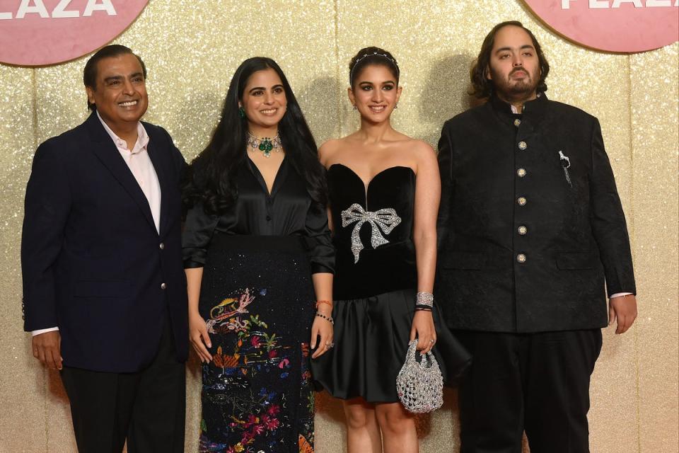 Mukesh Ambani, his daughter Isha Ambani, son Anant Ambani and Radhika Merchant attend the launch of the Jio World Plaza mall in Mumbai (AFP via Getty)