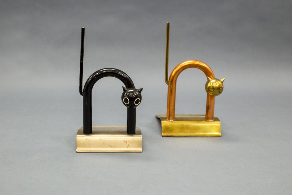 Chase Brass & Copper Company, Cat Door Stops, 1934, Enameled metal and brass, 8½ in. Gift of Enrique Conill Mendoza and AnaMari Goicoechea, via Florida Institute of Technology (FIT) 2021 Transfer. This is one of the works in 'Skylines to Hemlines: Art Deco Design from the Permanent Collection' at the Appleton Museum of Art.