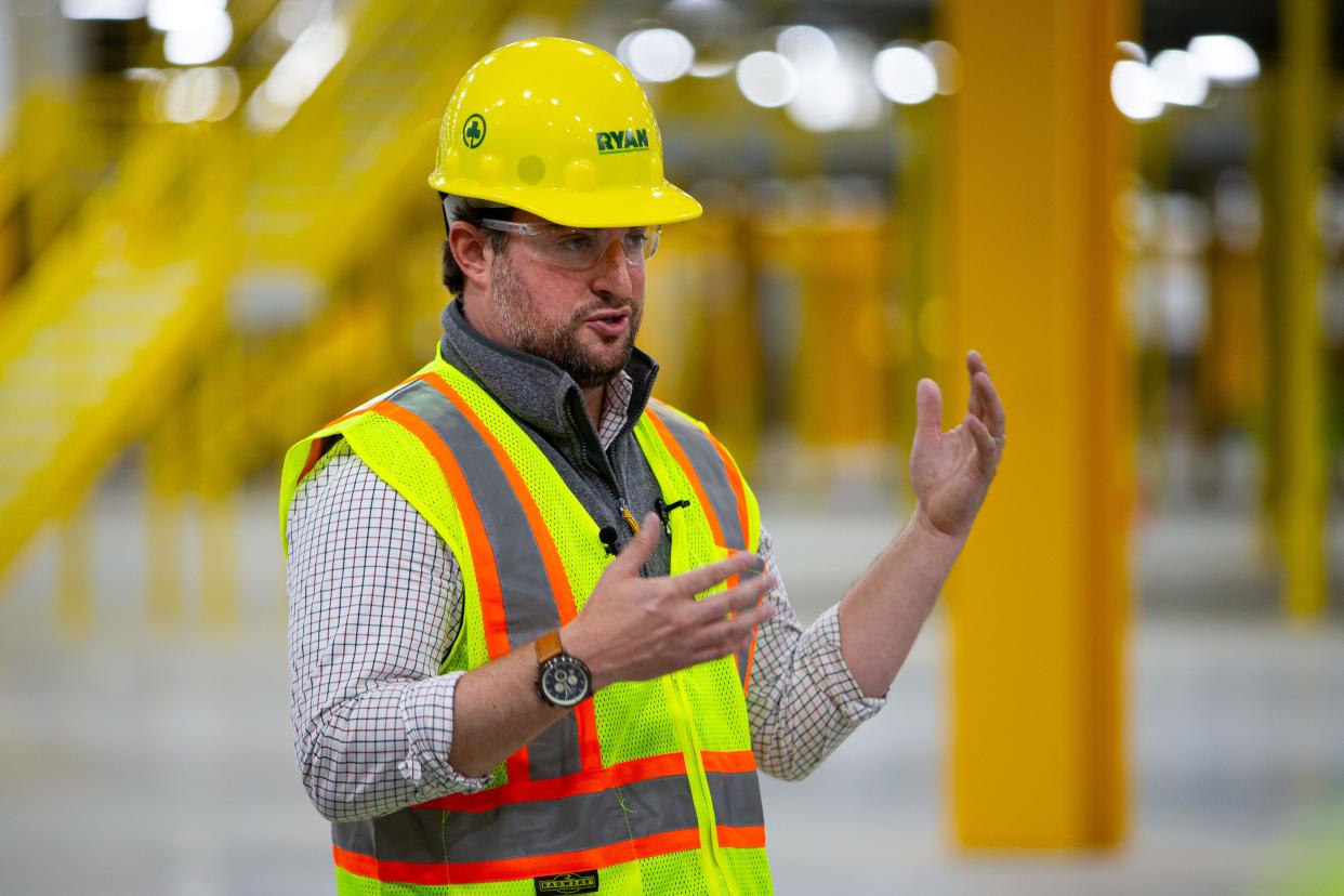 Kyle DeGiulio, senior economic development manager for Amazon, talks with media at Amazon's unfinished Elkhart Robotics Fulfillment Center on Thursday, May 9, 2024. The center is planned to open fall of 2025.