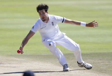 England's Steven Finn fields from his own bowling during the second cricket test match against South Africa in Cape Town, South Africa, January 3, 2016. REUTERS/Mike Hutchings