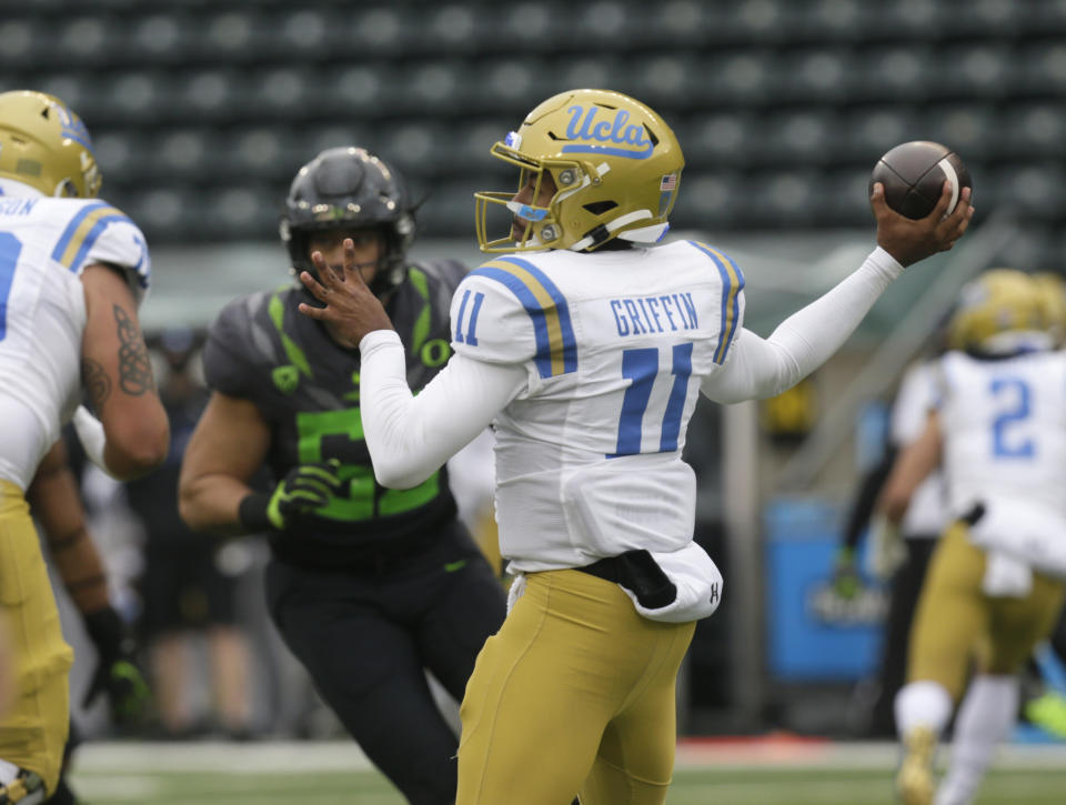 UCLA's Chase Griffin throws downfield against Oregon during the second quarter of an NCAA college football game Saturday, Nov. 21, 2020, in Eugene, Ore. (AP Photo/Chris Pietsch)