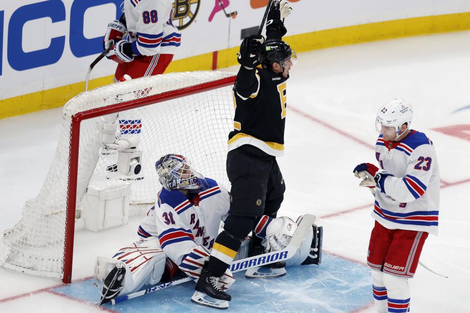 Boston Bruins' Tomas Nosek, center, celebrates his goal past New York Rangers' Igor Shesterkin (31) during the second period of an NHL hockey game, Saturday, March 4, 2023, in Boston. (AP Photo/Michael Dwyer)