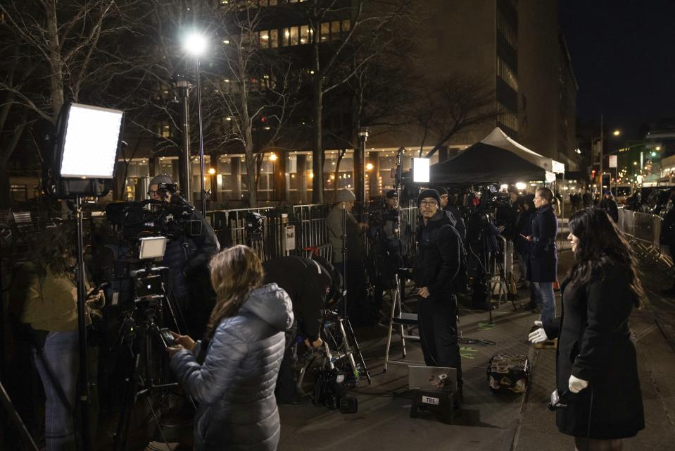 Members of the media are seen outside Manhattan Criminal Court in New York, Thursday, March. 30, 2023. Donald Trump has been indicted by a Manhattan grand jury, prosecutors and defense lawyers said Thursday, making him the first former U.S. president to face a criminal charge and jolting his bid to retake the White House next year. (AP Photo/Yuki Iwamura)