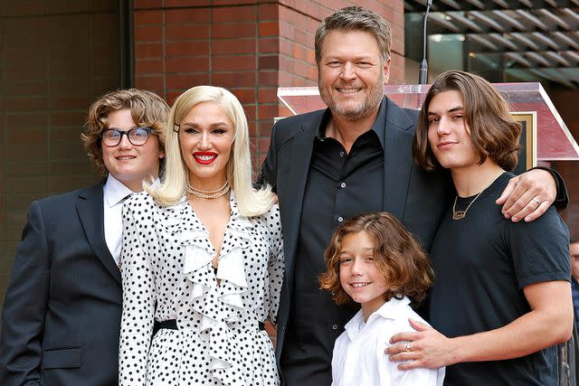 <p>Frazer Harrison/Getty</p> Gwen Stefanie with husband Blake Shelton and sons Zuma, Apollo and Kingston