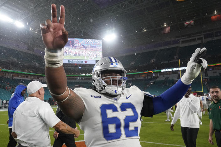 Middle Tennessee offensive lineman Jordan Palmer (62) celebrates after Middle Tennessee beat Miami 45-31 in an NCAA college football game, Saturday, Sept. 24, 2022, in Miami Gardens, Fla. (AP Photo/Wilfredo Lee)