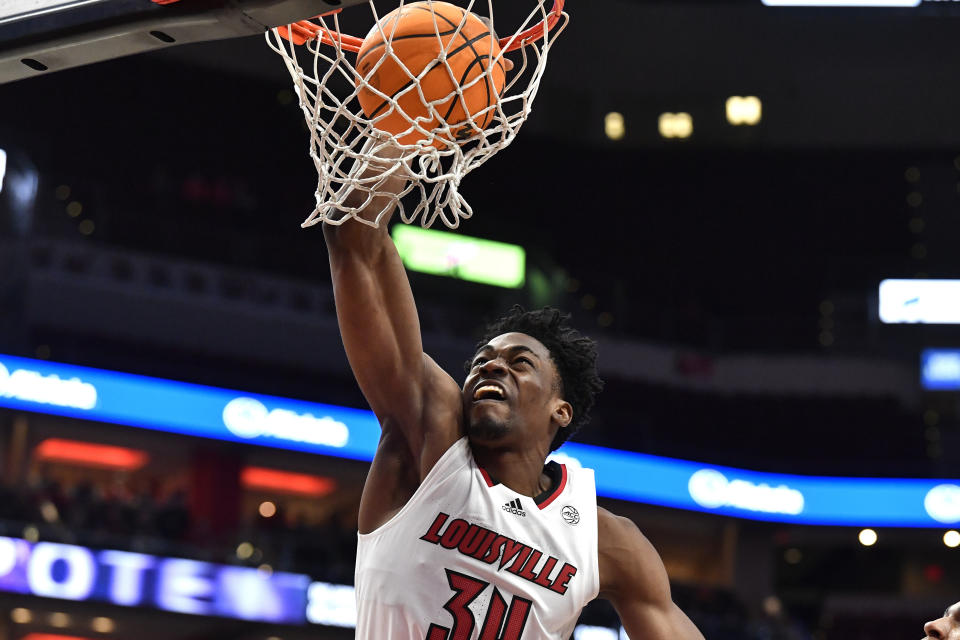 Louisville forward Emmanuel Okorafor (34) scores during the second half of an NCAA college basketball game against Georgia Tech in Louisville, Ky., Wednesday, Feb. 1, 2023. Louisville won 68-58. (AP Photo/Timothy D. Easley)