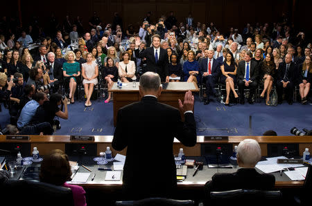 U.S. Supreme Court nominee Judge Brett Kavanaugh is sworn in by Committee Chairman Chuck Grassley to testify at his U.S. Senate Judiciary Committee confirmation hearing on Capitol Hill in Washington, U.S., September 4, 2018. Doug Mills/Pool via REUTERS