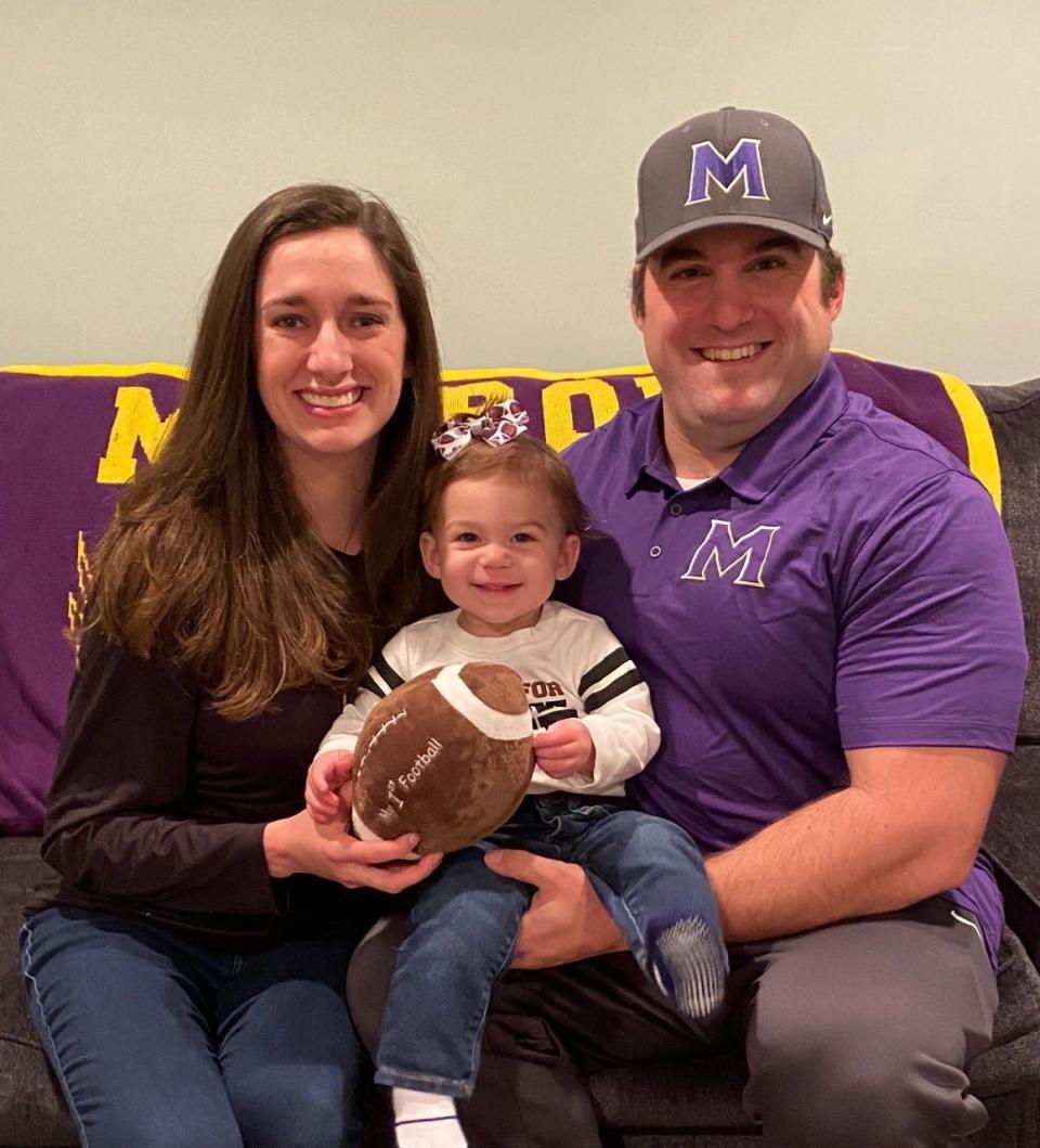 Monroe football coach Dan Lee with his wife Kate and their 1-year-old daughter Louise