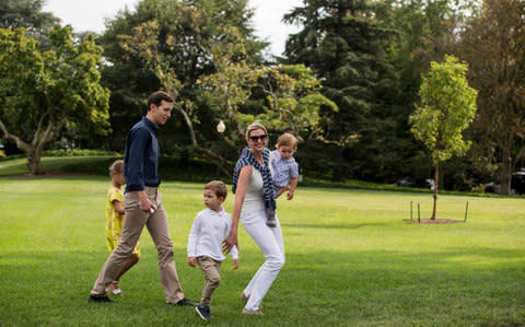 Ivanka Trump walks across the South Lawn of the White House with her children, Arabella, Joseph, and Theodore, and her husband - Credit: CNP