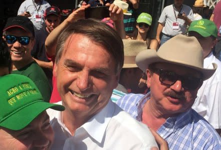 Nabhan Garcia (R), the head of farmers group, is seen next to Jair Bolsonaro, far-right lawmaker and presidential candidate of the Social Liberal Party (PSL) in Ribeirao Preto, Brazil April 30, 2018. REUTERS/Marcelo Teixeira