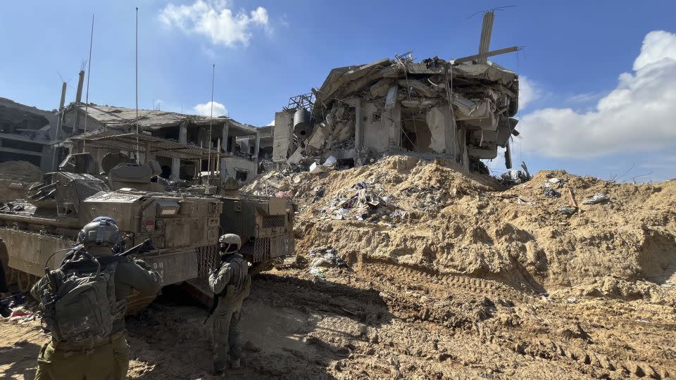 Israeli soldiers patrol the area around an entrance into the tunnel network found underneath Khan Younis in southern Gaza on Sunday, February 4. - Ivana Kottasová/CNN