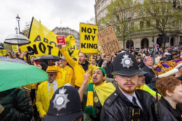 People protest the British monarchy in London on the weekend of King Charles' coronation.