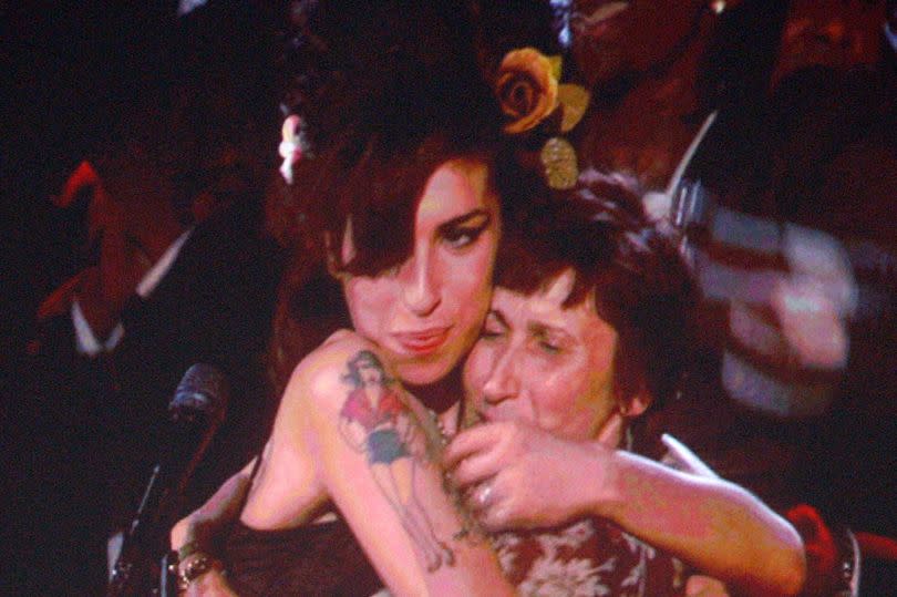 Amy hugs her mother Janis after winning Record of the Year for 'Back to Black' at the Grammy awards in 2008