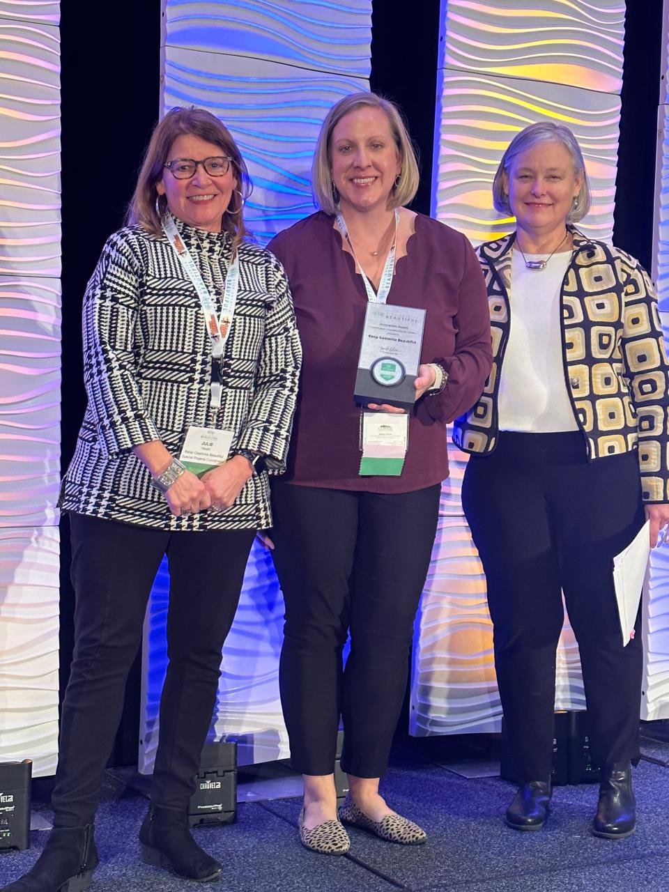 Juliann Lehman (center), Keep Gastonia Beautiful administrator, and Julie Heath (left), Keep Gastonia Beautiful special projects coordinator, receive the Keep America Beautiful Innovation Award from Jennifer Lawson, Keep America Beautiful president and CEO (right).