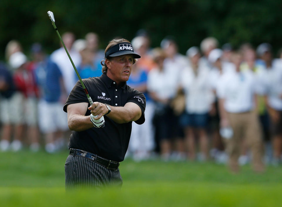 CARMEL, IN - SEPTEMBER 09: Phil Mickelson watches his approach shot on the first hole during the final round of the BMW Championship at Crooked Stick Golf Club on September 9, 2012 in Carmel, Indiana. (Photo by Scott Halleran/Getty Images)