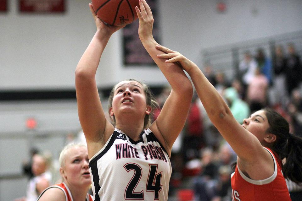 White Pigeon's Sadie McDaniel is fouled on her way up for a shot against Gobles in prep hoops action on Wednesday.