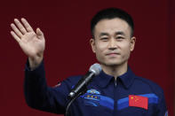 Tang Shengjie, a Chinese astronaut for the upcoming Shenzhou-17 mission waves during a meeting with the press at the Jiuquan Satellite Launch Center in northwest China, Wednesday, Oct. 25, 2023. (AP Photo/Andy Wong)