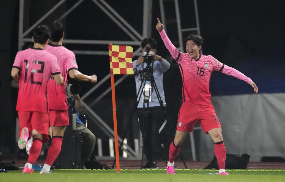 South Korea's Hwang Ui-jo, right, celebrates his goal against Turkmenistan during their Asian zone Group H qualifying soccer match for the FIFA World Cup Qatar 2022 at Goyang stadium in Goyang, South Korea, Saturday, June 5, 2021. (AP Photo/Lee Jin-man)
