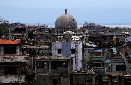 Damaged houses and buildings are seen after government troops cleared the area from pro-Islamic State militant groups inside the war-torn area in Marawi city, southern Philippines. REUTERS/Romeo Ranoco