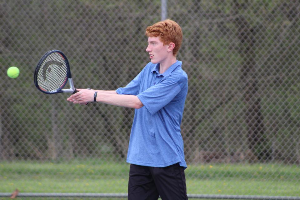 Ravenna's Parker Addison follows through on a backhand at the Metro Athletic Conference Tournament on May 4, 2022.