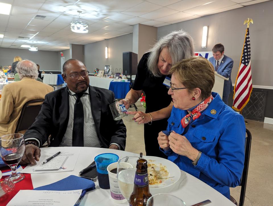 Dr. James Williams, coroner, left, speaks with Sandra Wise, Board of Elections member, center, and Rep Marcy Kaptur at the Sandusky County Democratic Party spring dinner Wednesday at the Victor Event Center in Fremont.