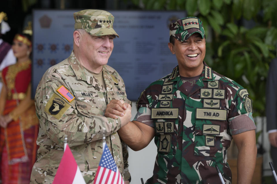 U.S. Chairman of the Joint Chiefs of Staff Gen. Mark Milley, left, shakes hands with ndonesian Armed Forces Chief Gen. Andika Perkasa during their meeting at Indonesian military headquarters in Jakarta, Indonesia, Sunday, July 24, 2022. (AP Photo/Achmad Ibrahim)