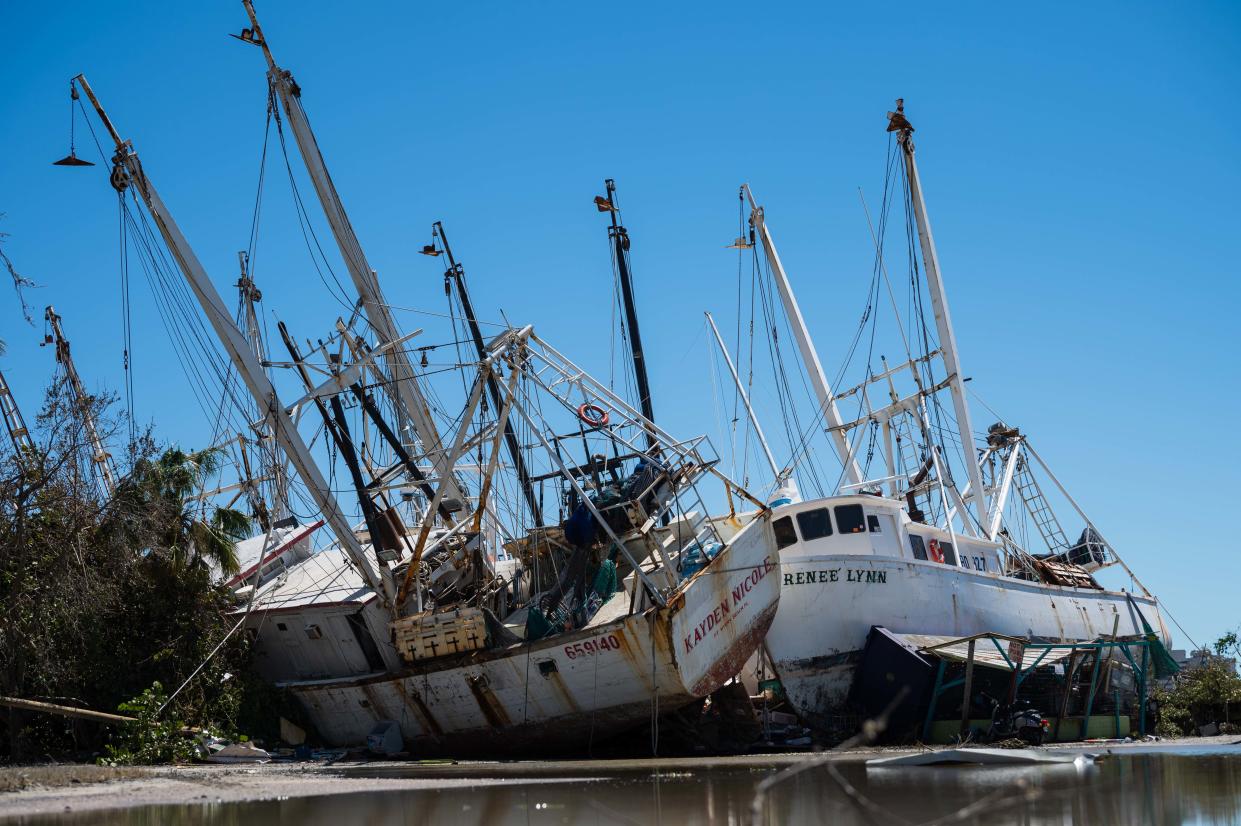 Shrimp boats remained beached on Friday near Trico Shrimp Co. on San Carlos Island after Hurricane Ian pummeled the Ft. Myers, Fla. region Wednesday.