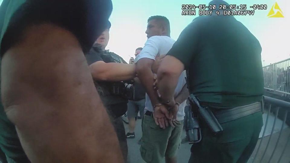 Body camera image shows Volusia Sheriff's deputies arresting a suspect in a wave of thefts at the Welcome To Rockville music fest on Friday.