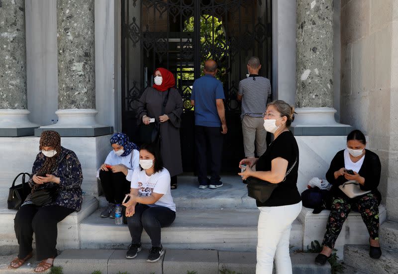 FILE PHOTO: Parents wait outside the main campus of the Istanbul University during the national university entrance exams