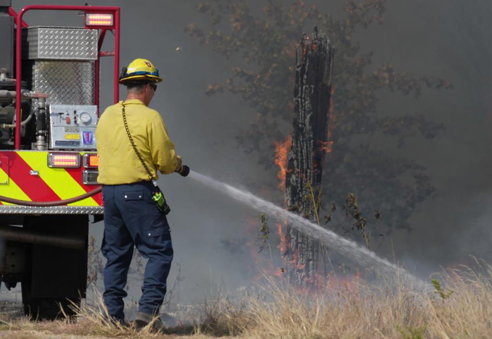 A blaze from Bastrop County's Powder Keg Fire burns on Tuesday. Firefighters on Friday were still battling the blaze but are closer to having it fully contained.