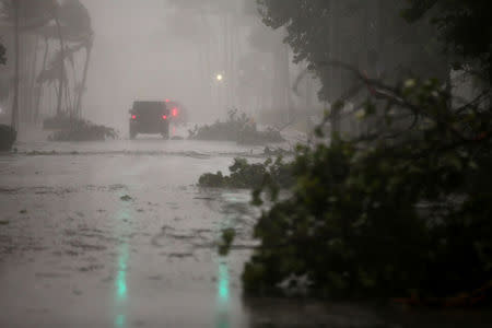 Vehicles drive along Ocean Drive in South Beach as Hurricane Irma arrives at south Florida, in Miami Beach, Florida, U.S. September 10, 2017. REUTERS/Carlos Barria