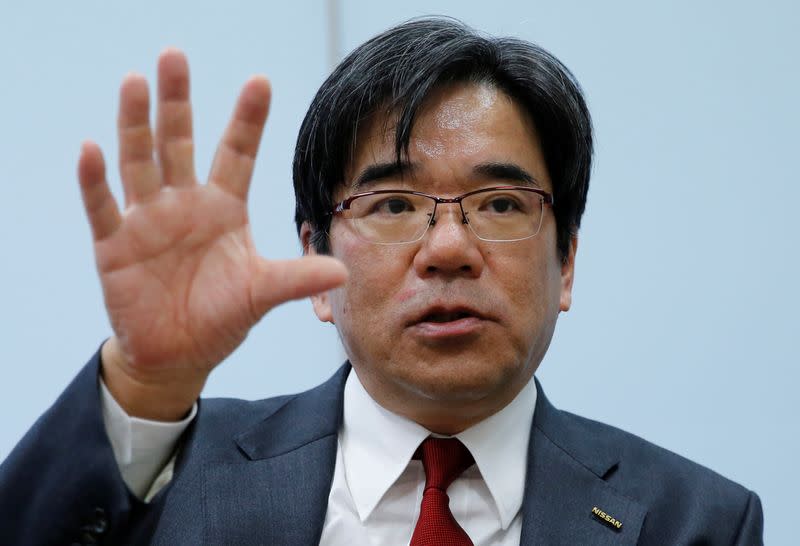 FILE PHOTO: Nissan Executive Vice President Sakamoto speaks during an interview with Reuters at the carmaker's headquarters in Yokohama