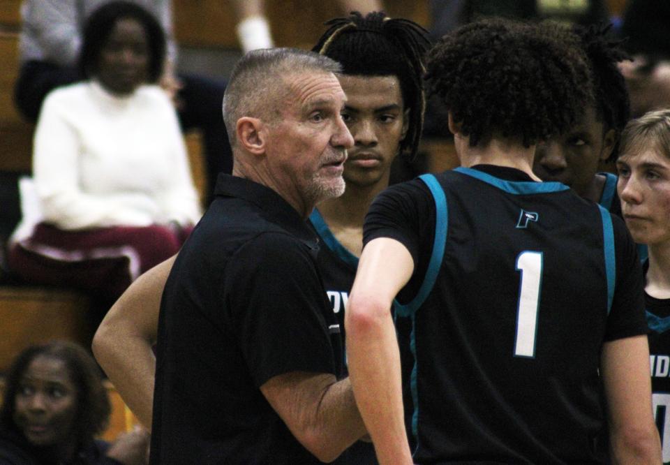 Providence coach Jim Martin huddles with players during a timeout against Nease during the High School 9:12 Fortegra Invitational for boys basketball at FSCJ South Campus on December 10, 2022. [Clayton Freeman/Florida Times-Union]