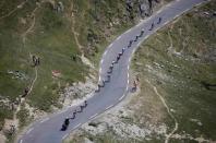 The pack of riders cycle along the Tourmalet pass during the 188-km (116.8 miles) 11th stage of the 102nd Tour de France cycling race from Pau to Cauterets in the French Pyrenees mountains, France, July 15, 2015. REUTERS/Eric Gaillard